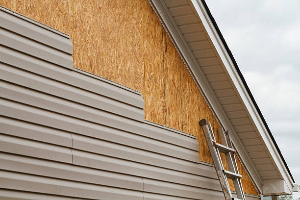 Professional Siding Installation technician working in Melbourne Beach, FL